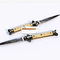Two Sharp Knives With Wooden Handles Placed Side By Side On White Background