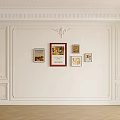 White Wall Interior With Decorative Molding And Framed Artworks And Herringbone Wooden Floor Design