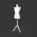 White Dress Form with Wooden Tripod Stand on Simple Dark Background
