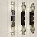 Three Modern Wall Lamps With Cage Design And Shadow Effect On White Wall