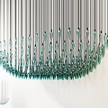 Modern Elegant Chandelier With Long Metal Rods And Teal Glass Droplets Design