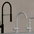 Three Modern Kitchen Faucets In Black Silver And White Finishes On Countertop