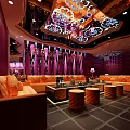 Luxury KTV Lounge Interior With Modern Sofas Decorative Walls And Elegant Chandeliers