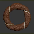Golden Brown Ring Shaped Pastry With Textured Surface And White Cream Filling