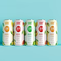 Six Cans Yuli Brand Beverages With Various Flavors Fruit Designs on Light Blue Background