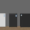 Three Small Refrigerators In White Dark Gray And Black Standing Against Wall On Wooden Floor