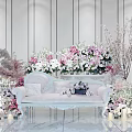 Elegant Floral Art Decoration With White Sofa Various Flowers Green Plants And Candles