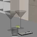 Clear Martini Glasses With Lime Wedge Small Glass And Mobile Phone On White Tabletop