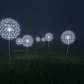 Dandelion Shaped Outdoor Lights With White Glow Standing In Grass Field At Night