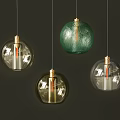Modern Glass Pendant Lights With Golden Bases Green And Transparent Shades On Dark Background