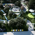 Park Landscape Including Children's Play Area Circular Pathways Trees White Umbrellas And Blue Water Features