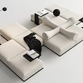 Modern beige modular sectional sofa with black trim side tables floor lamp and books
