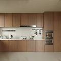 Modern Wooden Kitchen With Cabinetry Built In Ovens Cooktop Range Hood And Small Appliances