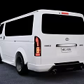 White Toyota Van With Modern Exterior Design Black Alloy Wheels And Tinted Windows