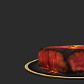 Sliced Lava Cake With Oozing Red And Yellow Center On Golden Rimmed Plate