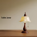 Classic Table Lamp With Brown Base And Cream Shade On Wooden Desk