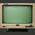 Vintage Computer Monitor With Green Screen And Beige Casing Design