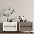 Modern White and Brown Bedside Tables with Woven Drawers Vase Plant Figurine and Books