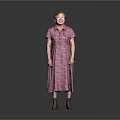 Woman in Pink Floral Dress with Neatly Styled Hair and Gray Shoes Against Gray Background