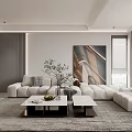 Modern Living And Dining Area With White Sofa Coffee Tables Rug Artwork And Plant