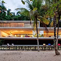 Modern Detached Villa with Beachfront Setting Palm Trees and Lush Greenery