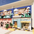 Vibrant Commercial Street With Colorful Shopfronts Outdoor Seating And Green Plants