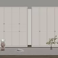 Modern White Wardrobe In Bedroom Interior With Small Doll Magazine And Plant