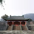 Ancient Chinese Architecture With Green Tiled Roof Overhanging Eaves And Stone Steps
