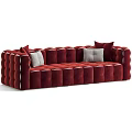 Burgundy Velvet Three Seater Sofa With Tufted Design And Decorative White Cushions