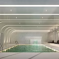 Modern Indoor Swimming Pool Design With Waterfall Feature And Seating Areas