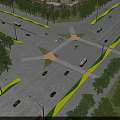 Municipal Road Intersection With Vehicles Driving Green Belts Trees Street Lamps And Surrounding Buildings