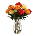 Beautiful Multicolored Roses Arrangement In Transparent Glass Vase With Green Leaves