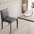 Modern Dark Gray Leather Dining Chairs With Wooden Dining Table And Vase Plant