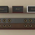 Stylish Marshall Audio Speakers On Wooden Shelf Black Red White With Multi Speaker Sound System
