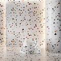 Black Marble Component with Sphere Base against Dark Columns and Circular Material Samples