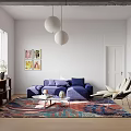 Living Room With Blue Sofa Colorful Area Rug And White Spherical Pendant Lights