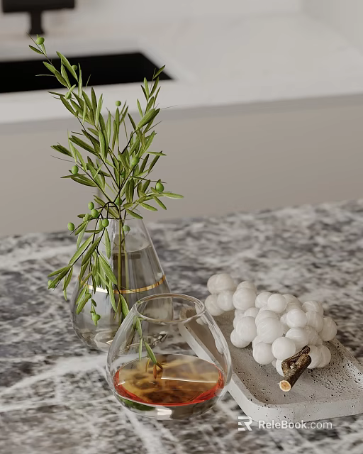 Decorative Ornament Set With Olive Branches Clear Vase And White Spherical Ornaments On Marble Tabletop 3d model 