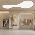 Elegant Modern Clothing Store Interior With Hanging Garments And Display Stands