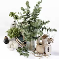 Decorative Ornament Combination Featuring Green Plants Vases Stacked Books And White Candles