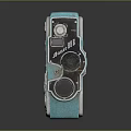 Vintage Turquoise Electronic Camera With Metal Frame And Retro Design Details