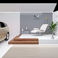 Modern Lincoln Golden Car Display With White Chair Green Plant And Decorations