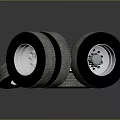 Stacked Car Tires With Silver Rims And Tread Patterns On Dark Surface 3d model