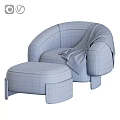 Plush Orange Lounge Chair With Matching Ottoman Blue Throw Blanket And Wooden Legs