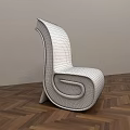 Yellow Modern Accent Chair With Unique Curved Design On Wooden Floor And Gray Wall