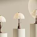 Elegant Table Lamps With White Lace Shades And Brown Bases On White Cylindrical Pedestals