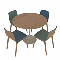Modern Round Wooden Table With White Legs And Four Colored Upholstered Chairs