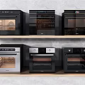 Kitchen Appliances Featuring Various Black And Gray Ovens Displayed On Shelves