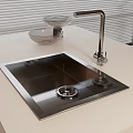 Stainless Steel Kitchen Sink With Faucet And Transparent Drainer Basket On White Countertop