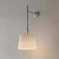 Modern Minimalist Wall Light With Metal Arm And Beige Fabric Shade On Light Wall