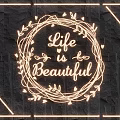 Illuminated Lighting Set with Wreath Design and Life is Beautiful Lettering on Dark Stone Wall